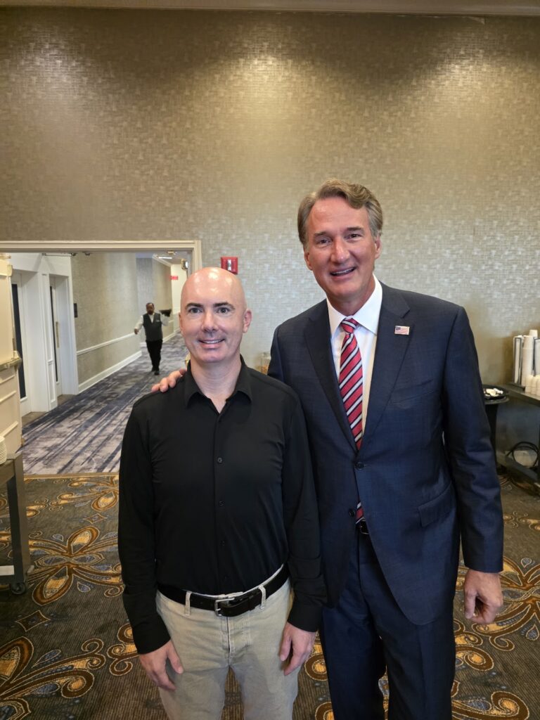 Matt Braynard with former Virginia Governor Glenn Youngkin in a Dallas hotel hallway.