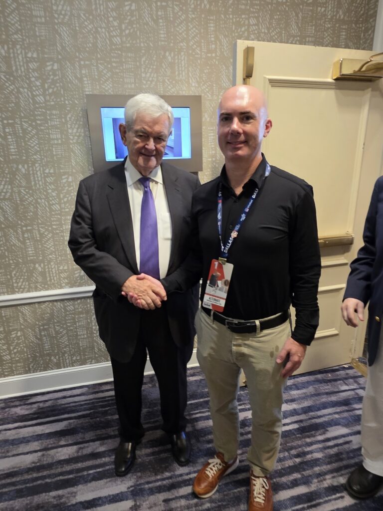 Matt Braynard and former Speaker of the House Newt Gingrich shake hands in Dallas.